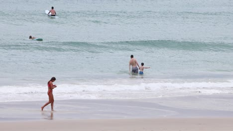 woman in bikini enjoys beach walk