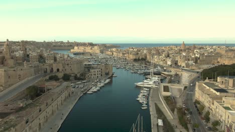 aerial shot over marina and old city 7