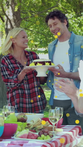 animation of spots over happy caucasian family having dinner