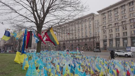 independence square in kyiv ukraine filled with lots of blue yellow flags of country and supporters