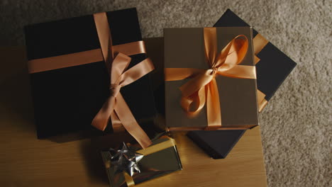 overhead shot of gifts or presents wrapped on table at home 3