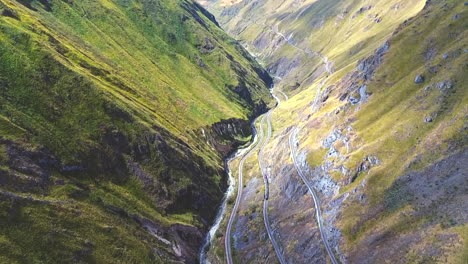 An-aerial-shot-of-a-train-going-around-the-"Nariz-del-Diablo"-or-Devil's-Nose-in-Alausí,-Chimborazo-Province,-Ecuador