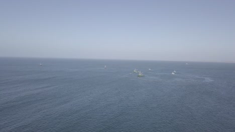 Aerial-Drone-Shot-of-Fishing-Boats-out-at-Sea