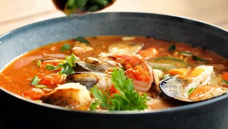 a bowl of steaming seafood soup