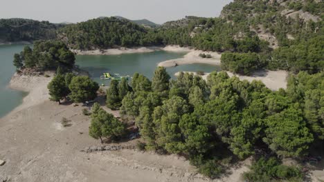 Aerial-view-of-Lakes-at-El-Chorro,-close-to-the-village-of-Ardales,-Spain-turquoise-water-reservoirs-or-‘Embalses