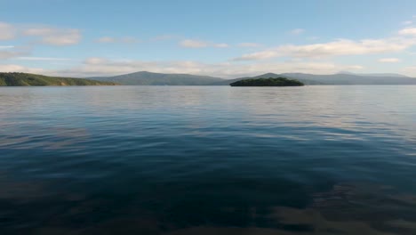 view from a boat on the driving towards a lone island