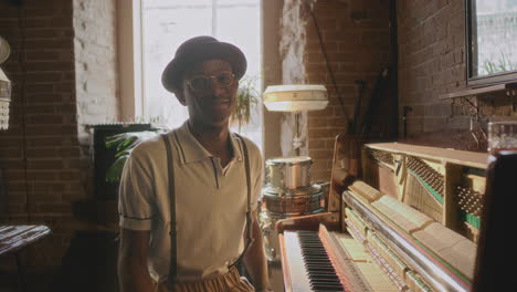 man playing piano in a vintage bar