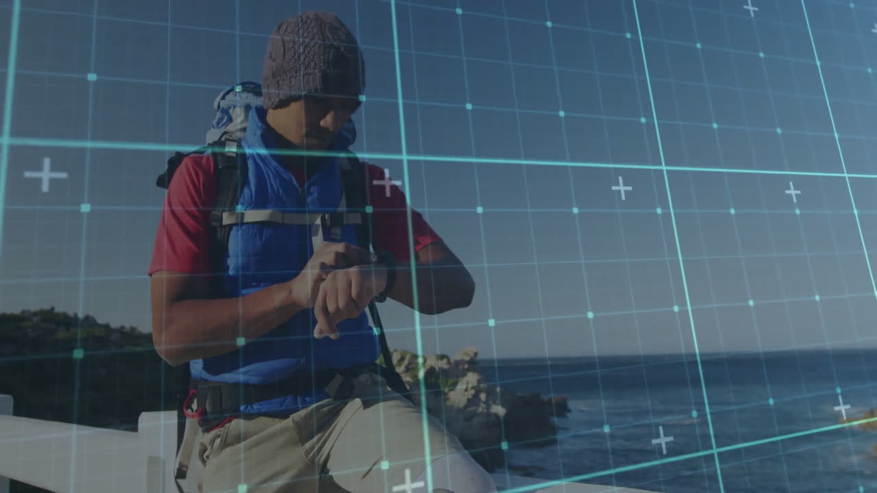 Checking smartwatch, man standing near ocean with digital animation grid pattern