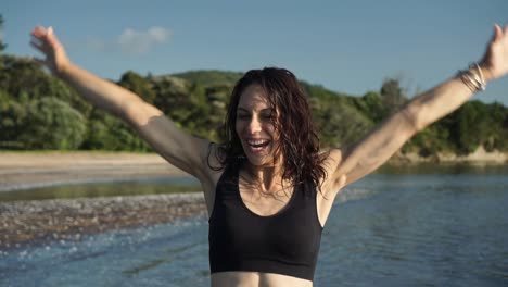 screaming and smiling girl on beach, real emotions, middle shot, slow motion