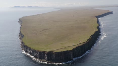 aerial shot of beautiful green flat peninsula named langanes during summer day on iceland island