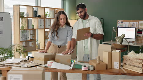 couple running a small online business packaging orders for shipping