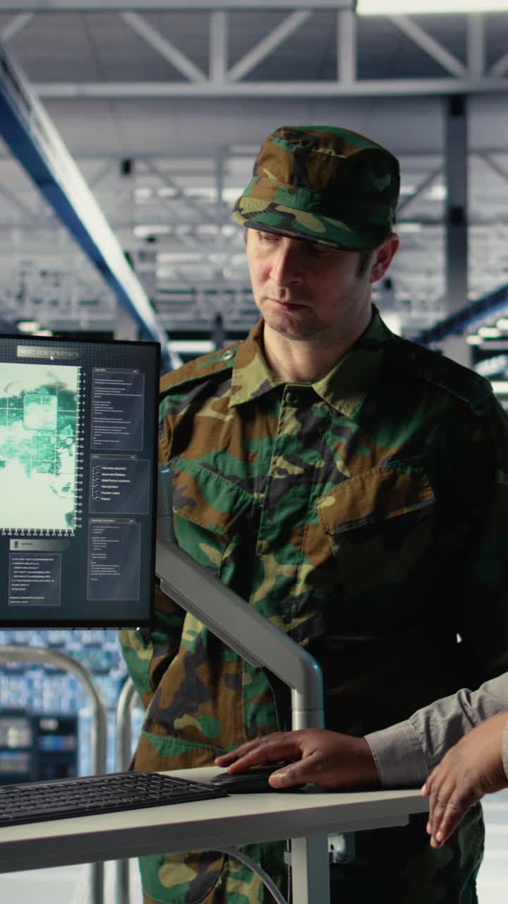 Vertical Video Team Of Military Specialists In Data Center Looking At World Map On Screen