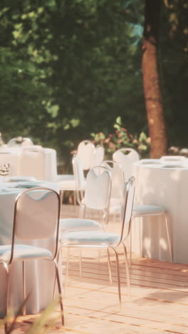 outdoor dining tables and chairs in a garden