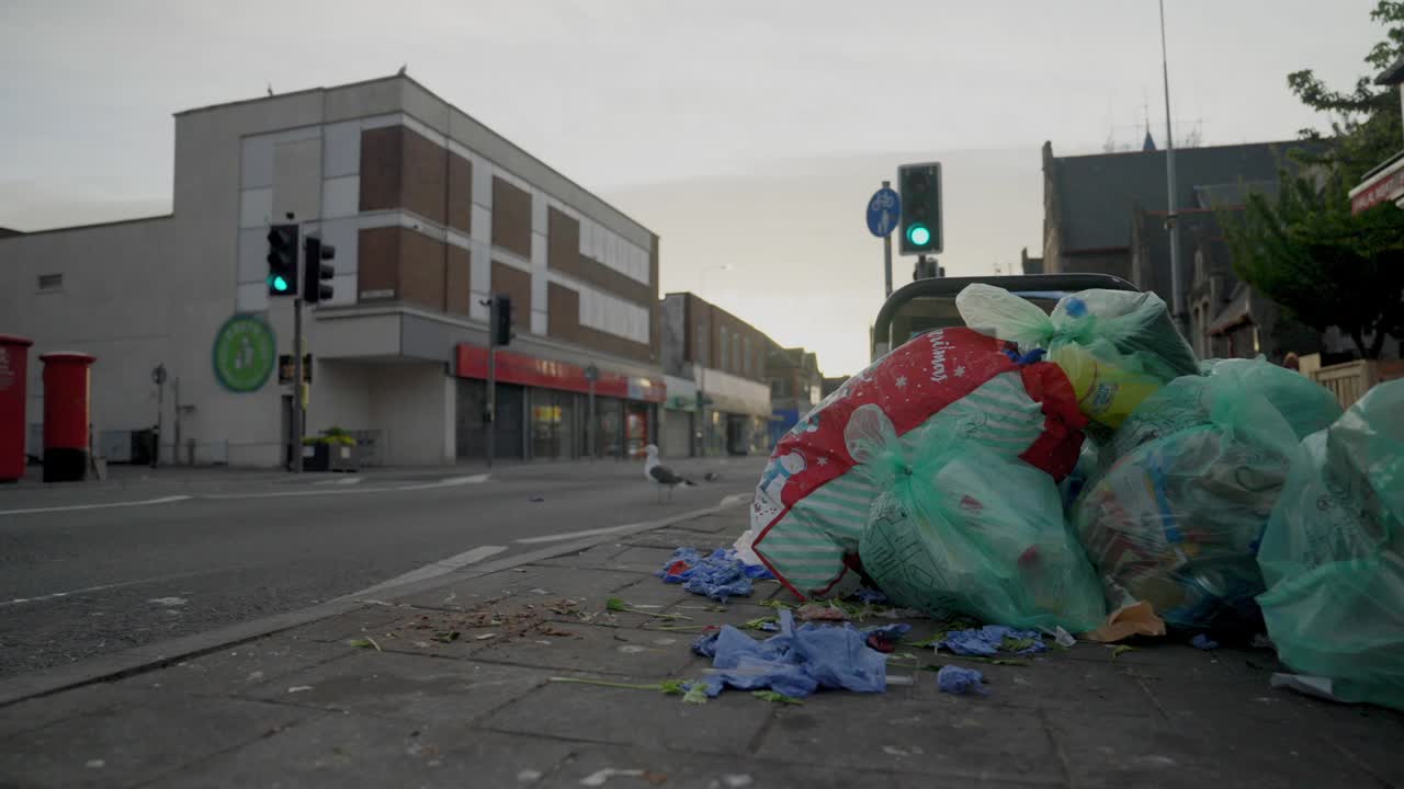 Wide shot of garbage on a street in Cardiff