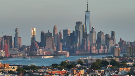 aerial view of hoboken, new jersey with the world trade center in the background. shot on a summer evening