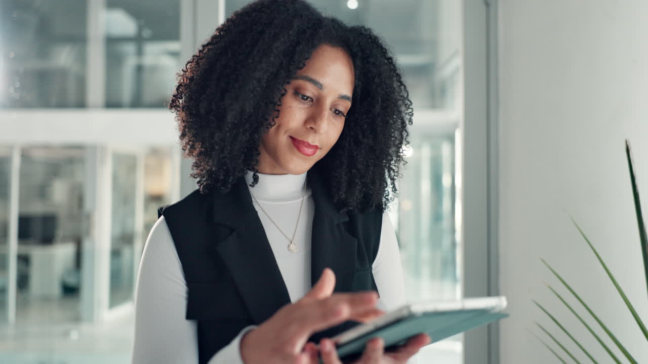 Businesswoman Using Tablet in Modern Office