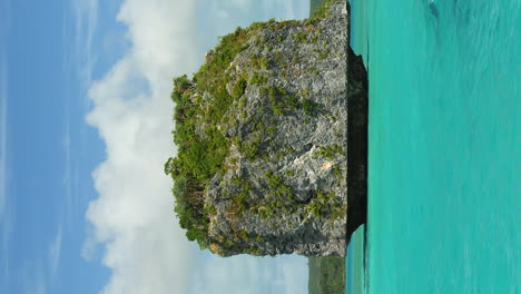 famous floating rocks on upi bay, isle of pines, vertical pov from canoe