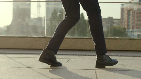 Anonymous-business-man-legs-dancing-at-street.-Businessman-stepping-on-sidewalk