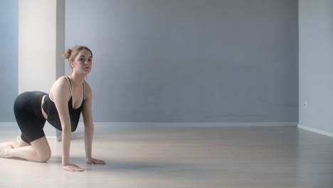 woman practicing dance moves in a studio