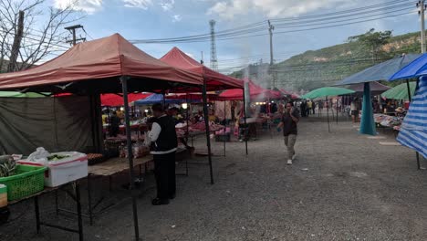 shoppers browse stalls at a lively market.