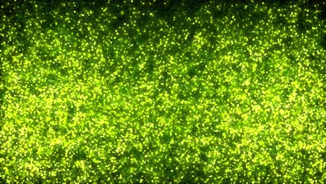 animation of luminous green atomic particles floating