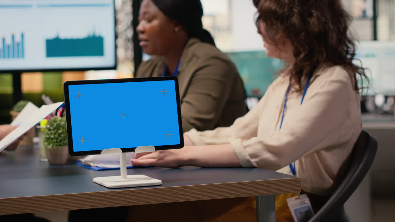 Multiethnic team of businesswomen with a mockup display