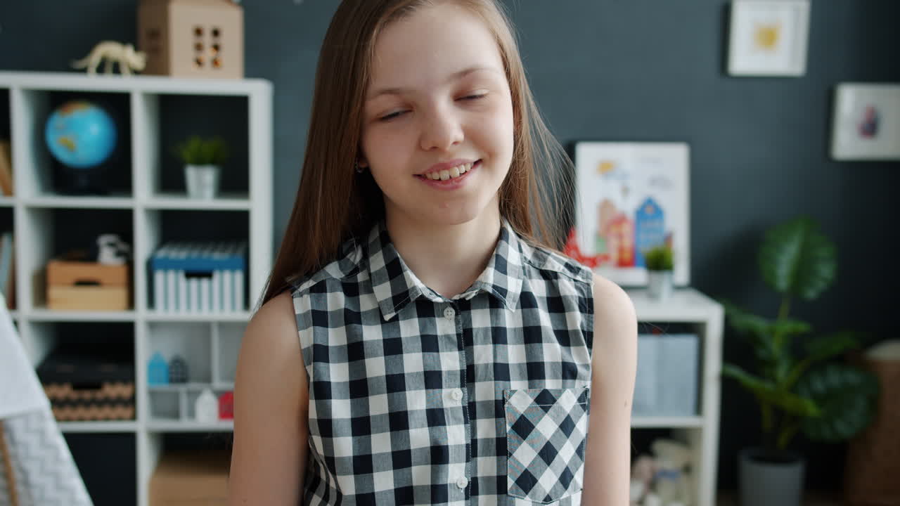 Smiling Girl in a Plaid Shirt