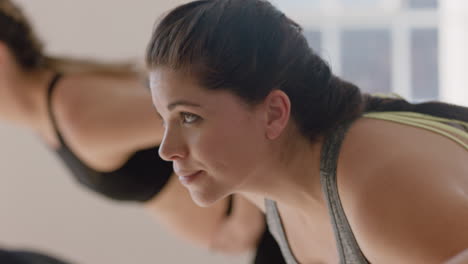 yoga class portrait young pregnant caucasian woman practicing poses holding belly enjoying group exercise in fitness studio