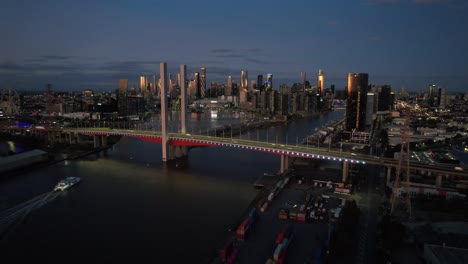 Aerial-toward-large-twin-cantilever-road-bridge-in-Melbourne-at-sunset