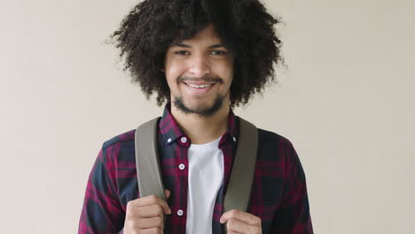 portrait of trendy young man close up of optimistic college student