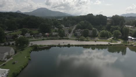 cloud sky reflects in lake junaluska in aerial retreat past auditorium