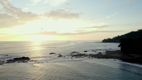 Aerial-drone-shot-of-beach-with-the-sky-at-dusk