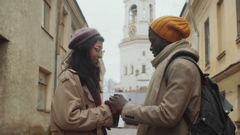 romantic multiethnic couple on date in old town