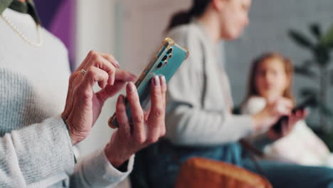 people using smartphones in a waiting room