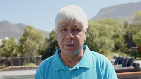 Portrait-of-happy-senior-caucasian-man-in-sunny-garden,-unaltered,-in-slow-motion