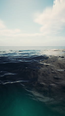 calm ocean waters under blue sky