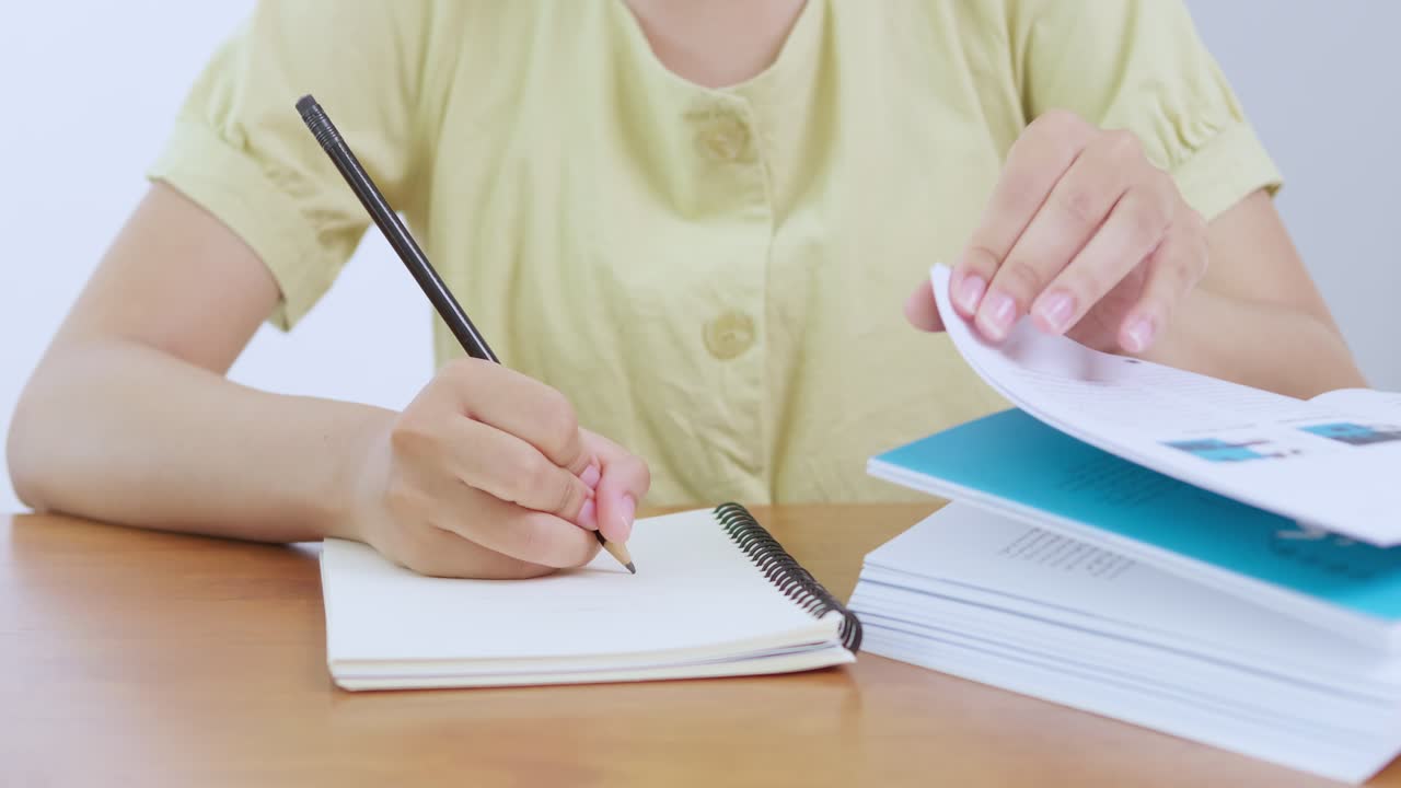 A student engages writing notes a classroom setting highlighting the importance of education