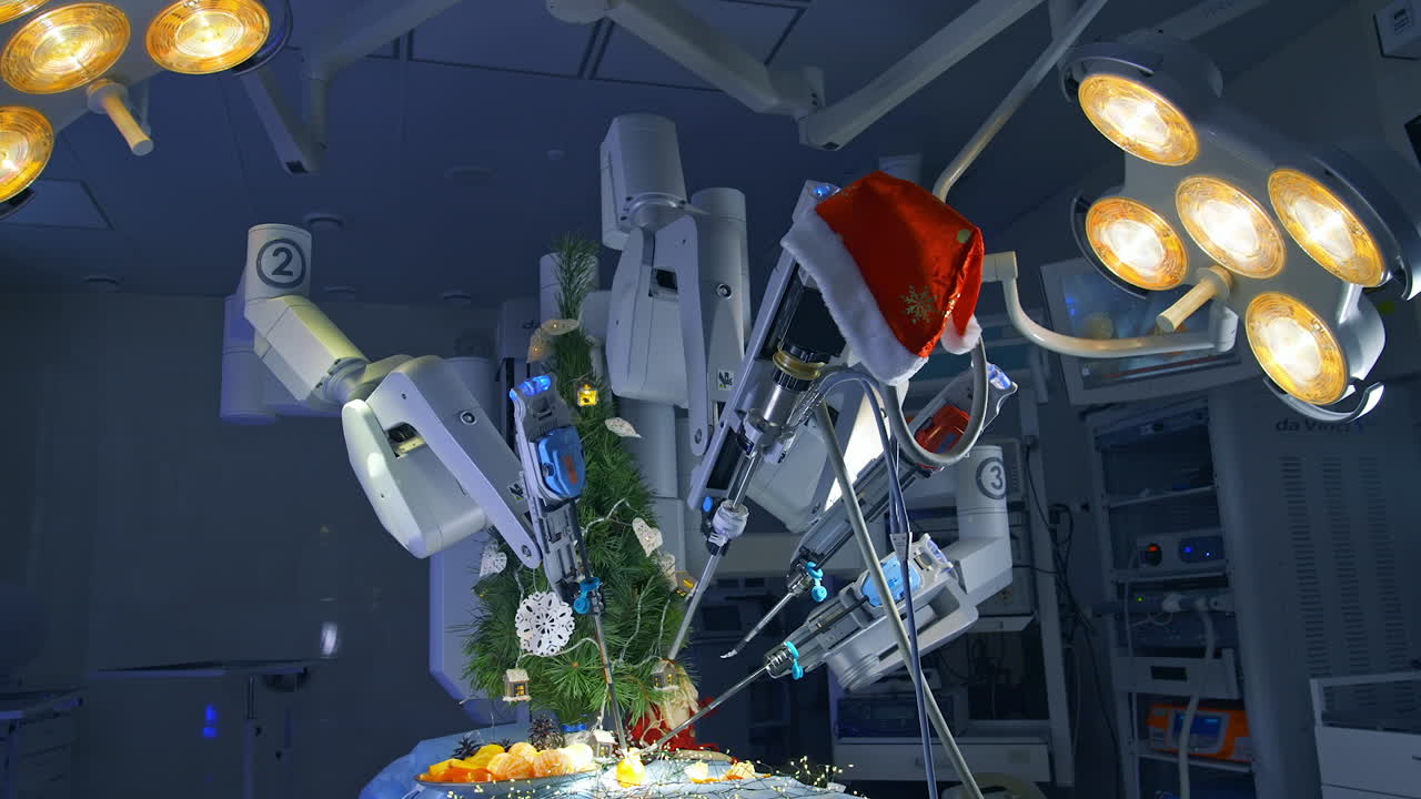 Robotic surgery machine peel the tangerines at the operating table. High technological equipment in the operating room with turned on lights. Christmas decorations in the operation room.
