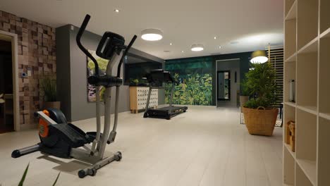 Slow-revealing-shot-of-fitness-equipment-in-a-home-gym-in-a-villa-in-France