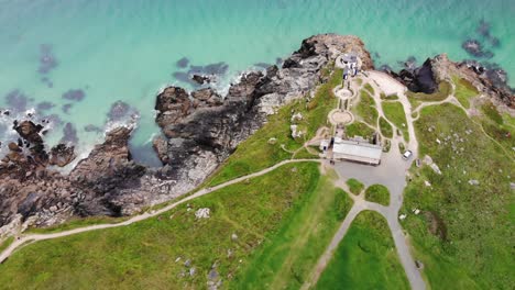 aerial above shot of turquoise waters and headland rocks at st ives cornwall england