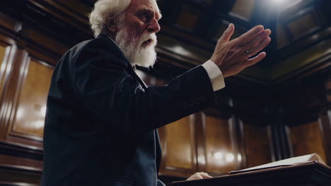 elderly man giving a speech