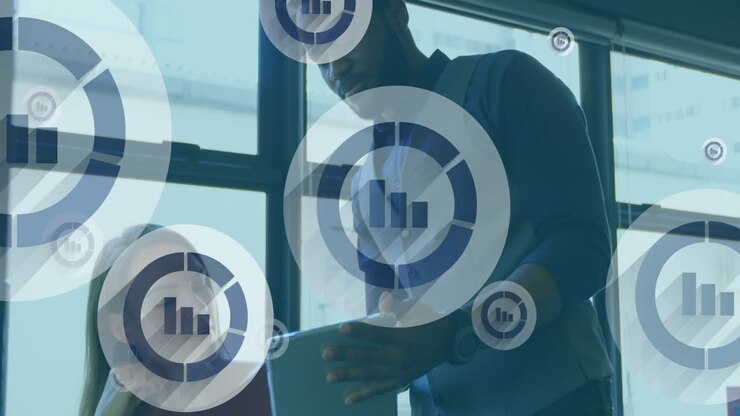 Animation of bar graph icons floating over diverse man and woman discussing over a tablet at office