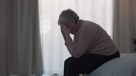 Crying,-depression-and-sad-woman-in-bedroom