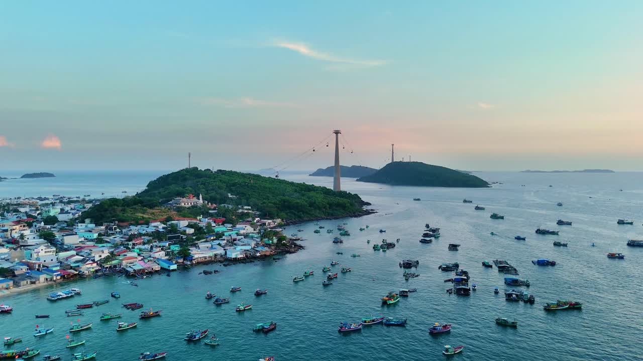 A fishing village with cable cars and fish boats during the day in Sunset Town, Phu Quoc Island, Vietnam.