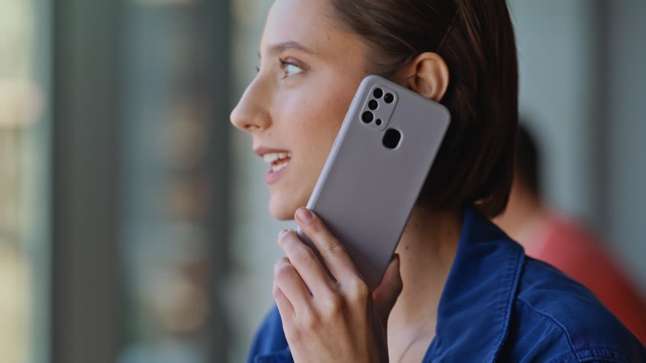 Calling brunette sharing news by cellphone sitting cafe closeup. Happy woman