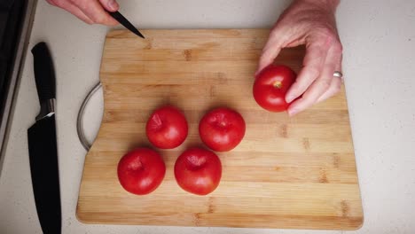 time lapse of chef preparing to roast tomatoes with balsamic vinegar and garlic