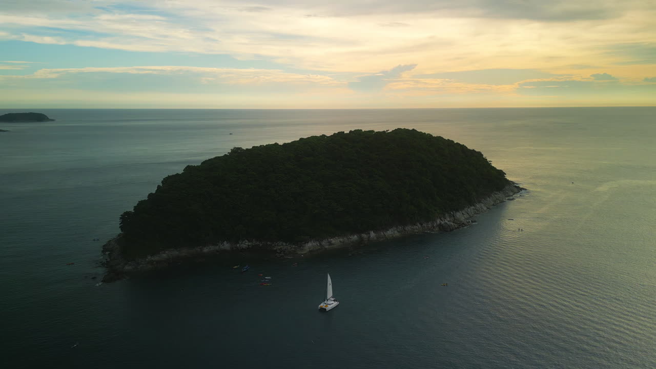 Island Sunset with Sailboat and Kayaks