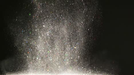 the fall of silvery particles. slow motion