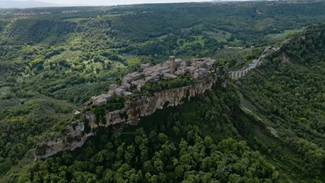 Aerial-over-the-hilltop-village-of-Civita-di-Bagnoregio,-Province-of-Viterbo,-Italy