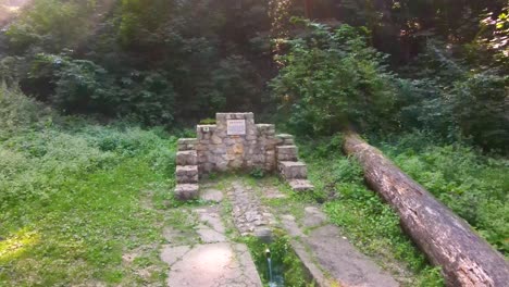 old stone monument at edge of forest near varbo, hungary near drainage